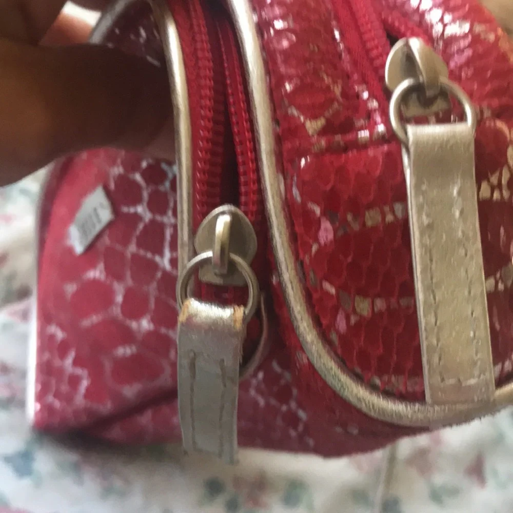 ELLE Bold and stylish Red cosmetic bag featuring Silver Snakeskin pattern.